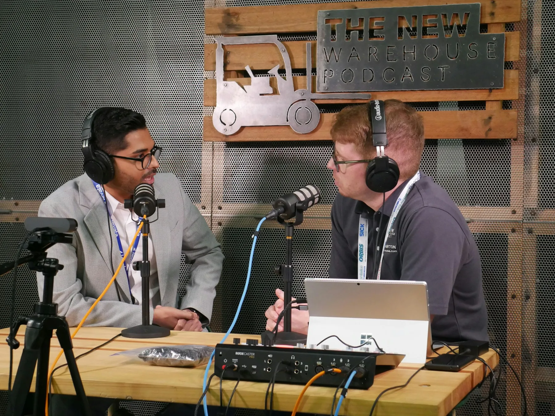 Two people recording a podcast conversation